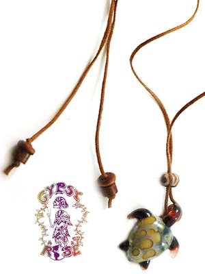 GLASS TURTLE ON CORD NECKLACE